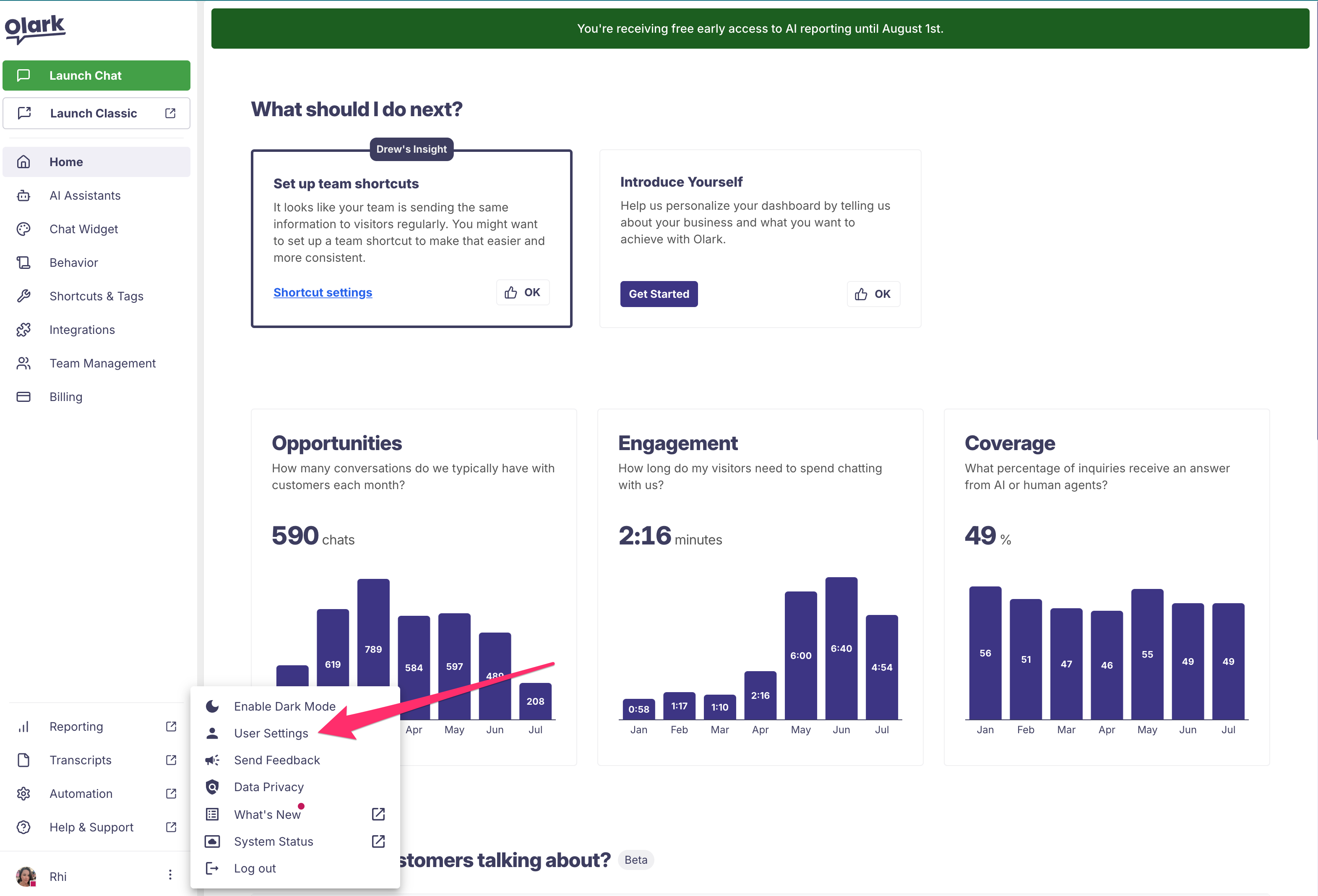 Screenshot of the expanded user menu. "User Settings" is highlighted with a red arrow.